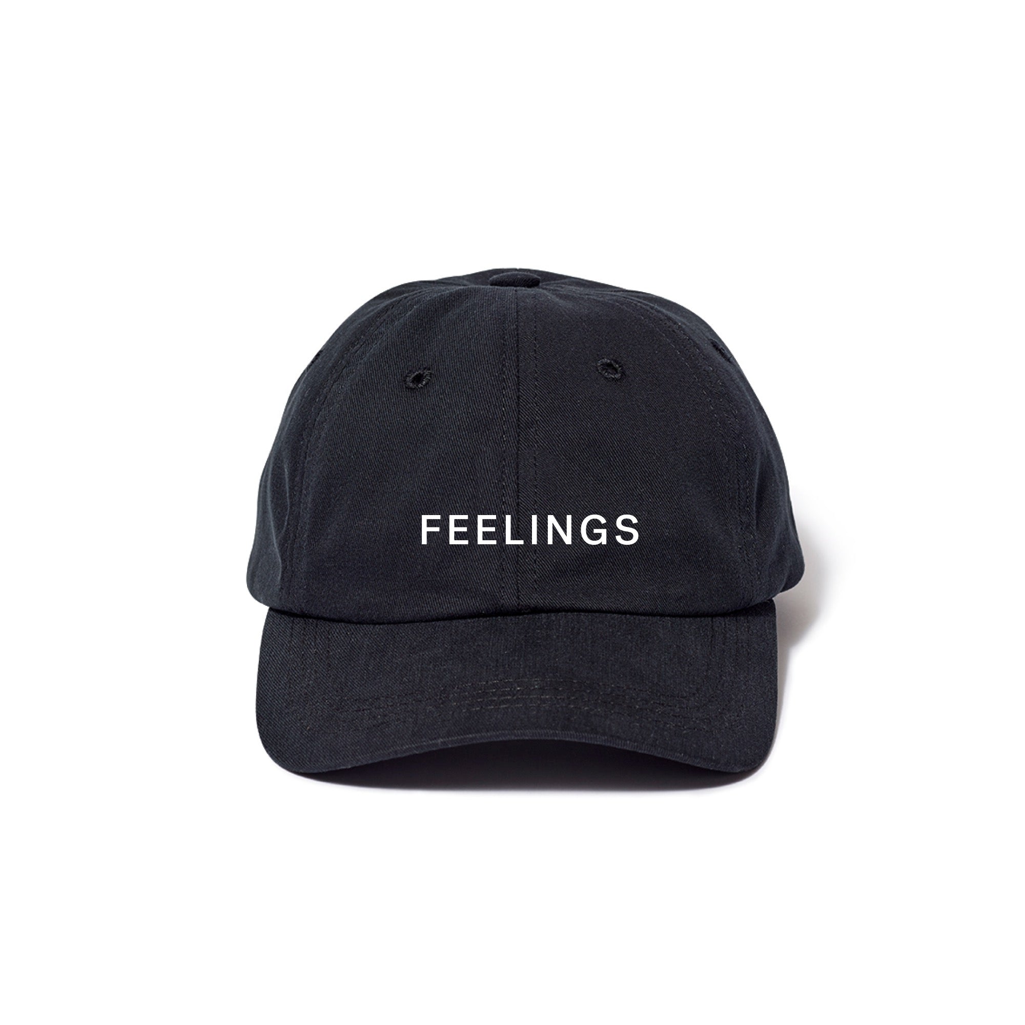 A dark-colored, unstructured 6-panel baseball cap with 'Feelings' embroidered on the front.