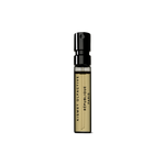 Small perfume sample vial bottle with black cap and text that says Republique Paris by Kismet Olfactive on a white background