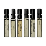 Set of Kismet Olfactive perfume samples on a white background