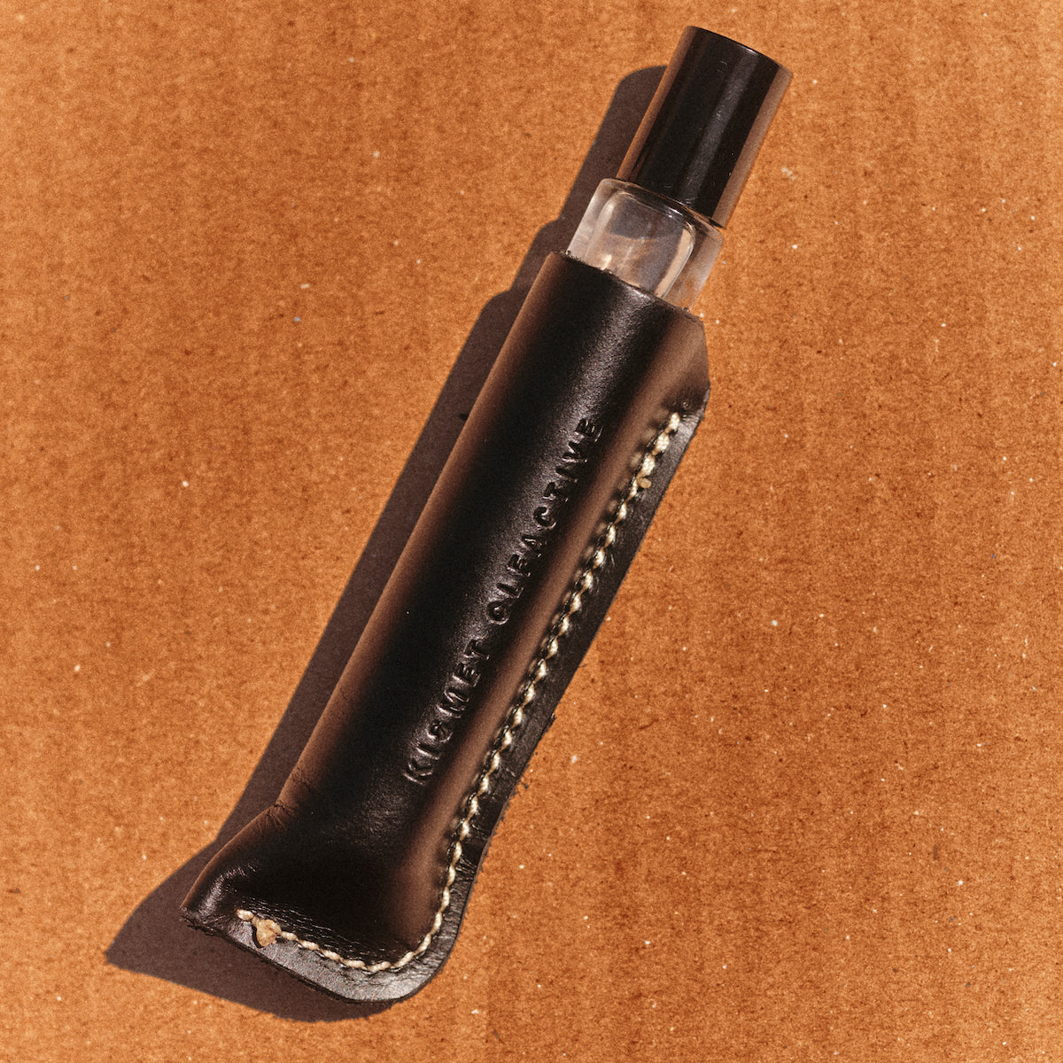 leather travel case for a perfume