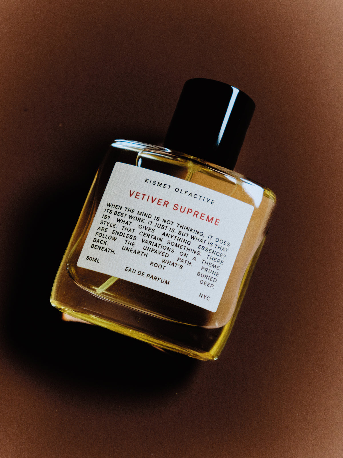 Kismet Olfactive Vetiver Supreme eau de parfum bottle on a dark background