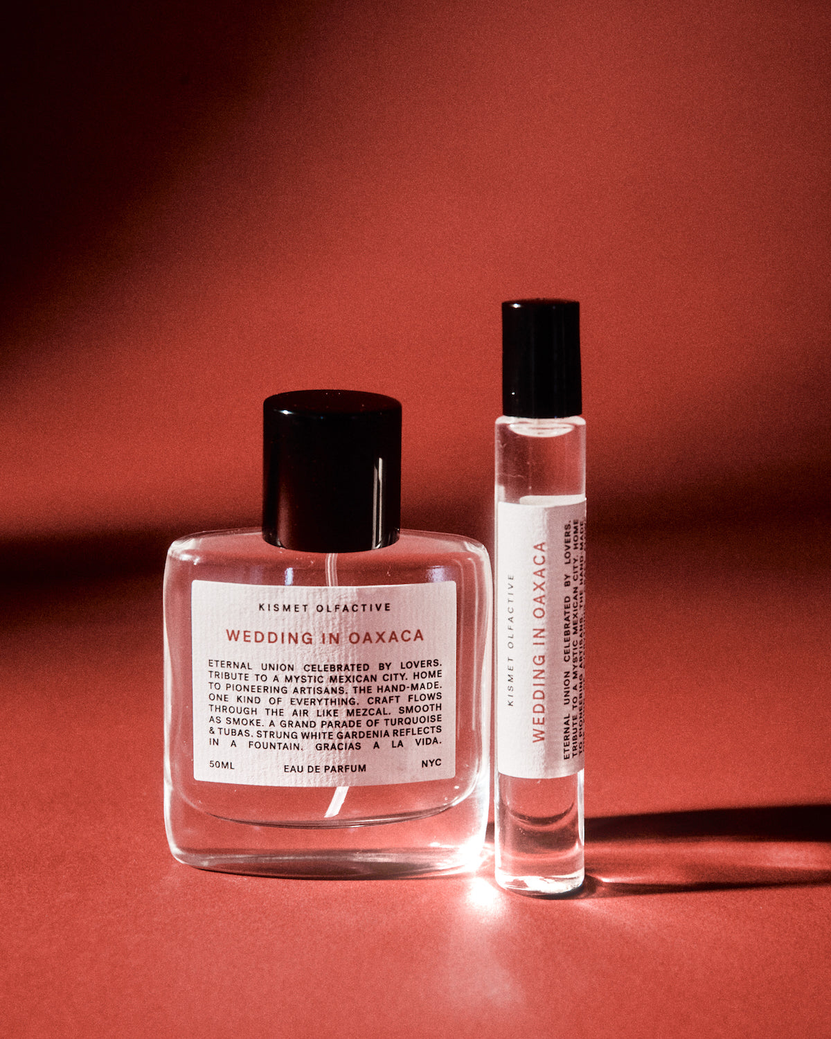 Two perfume bottles labeled 'Wedding in Oaxaca' on a red background